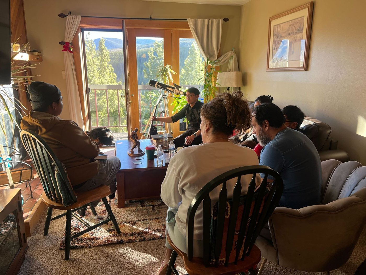 Members of Summit Bible Baptist Church studying the Bible together at a home Bible study in Copper Mountain